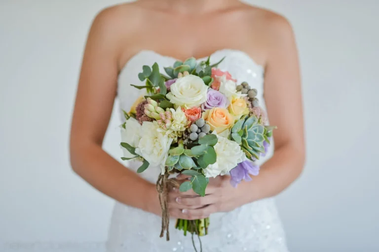 bride pastel rose succulent bouquet close up