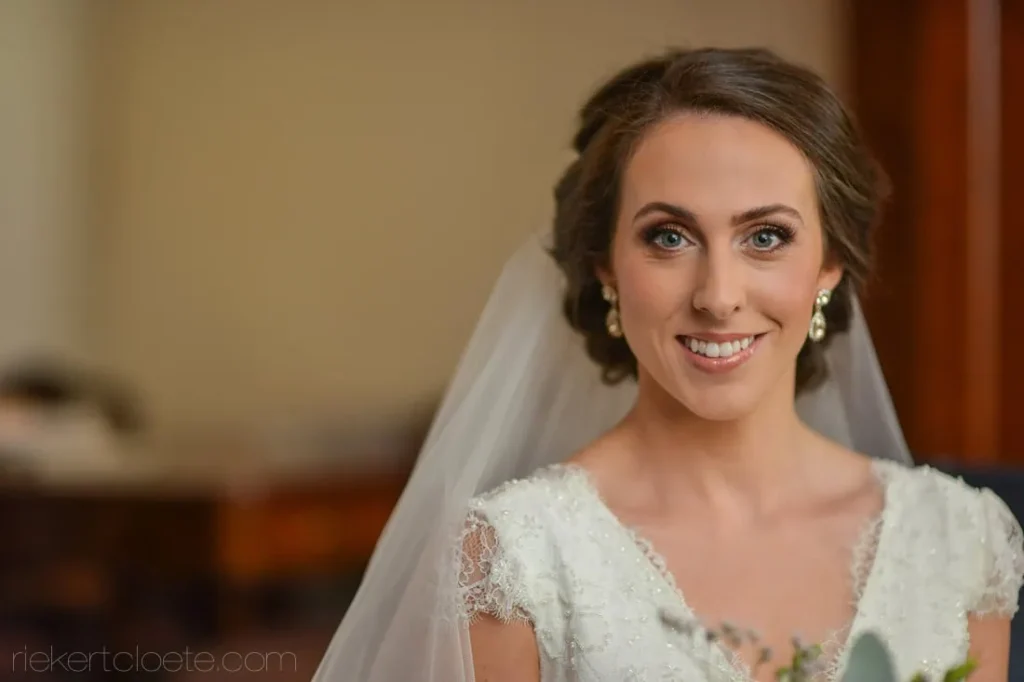 bride short dark updo veil lace cap sleeve gown