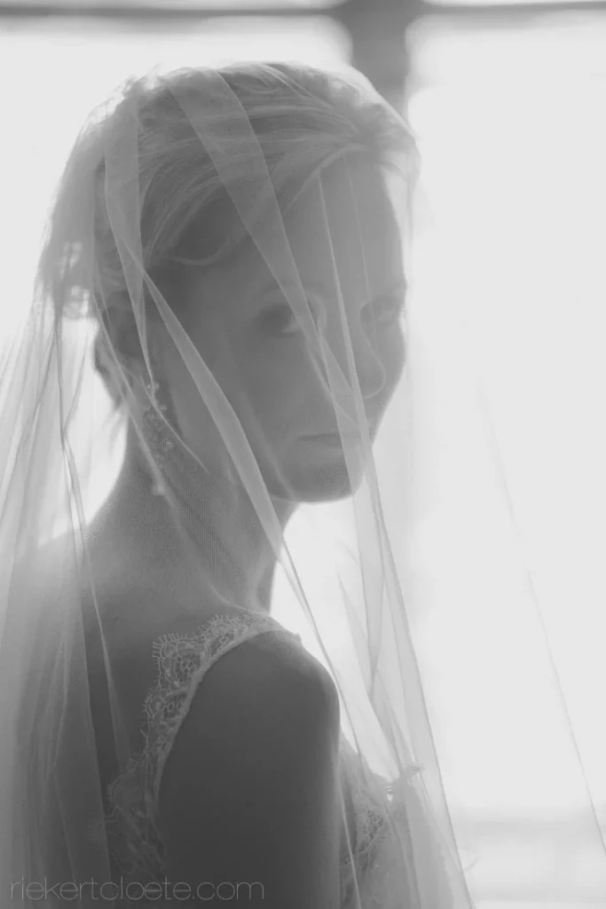 bride silhouette veil ethereal backlit window portrait