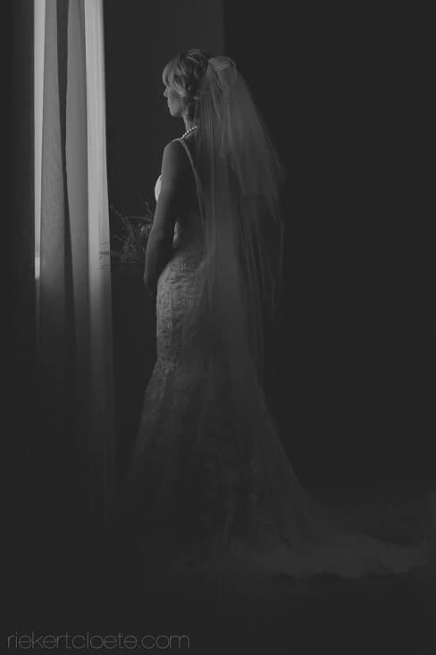 bride silhouette window light black white
