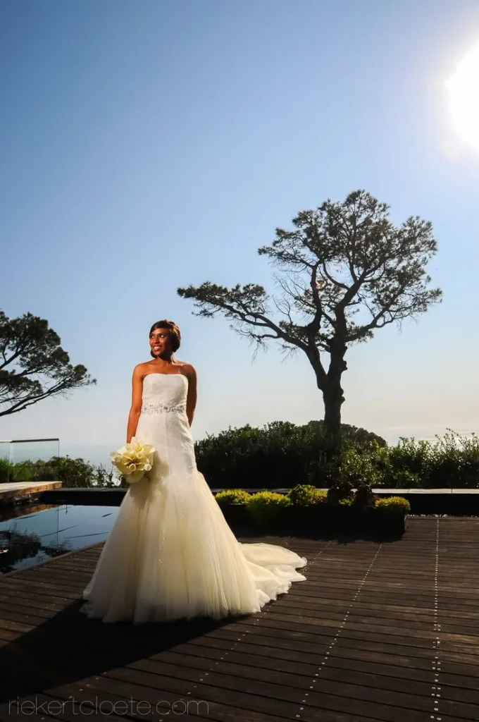 bride tulle gown wooden deck coastal tree sky