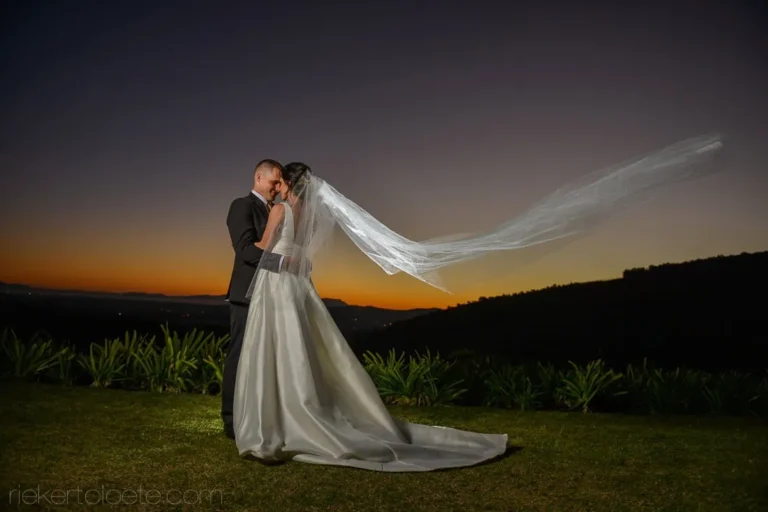 bride veil blowing wind golden sunset portrait