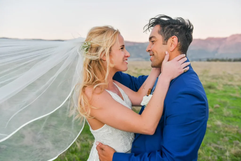 bride veil blowing wind groom blue suit stellenbosch
