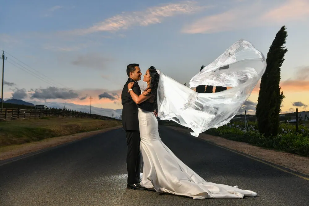 bride veil blowing wind road brenaissance sunset