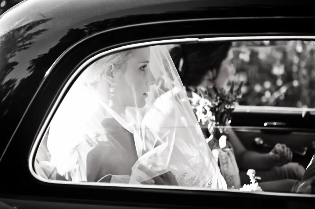 bride vintage wedding car veil window waiting