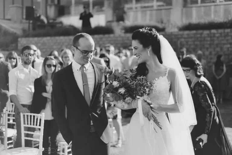 bride walking aisle father lace gown large bouquet