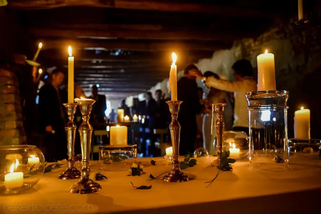 candlelit ceremony silver candelabras rustic stone venue