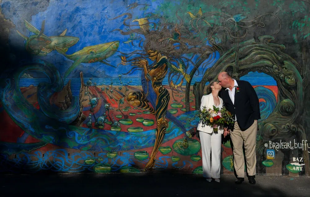 cape town elopement couple kiss colourful mural