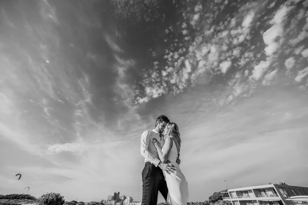 cape town elopement kiss dramatic sky beachfront