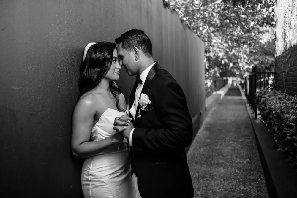 couple almost kissing stone alley brenaissance