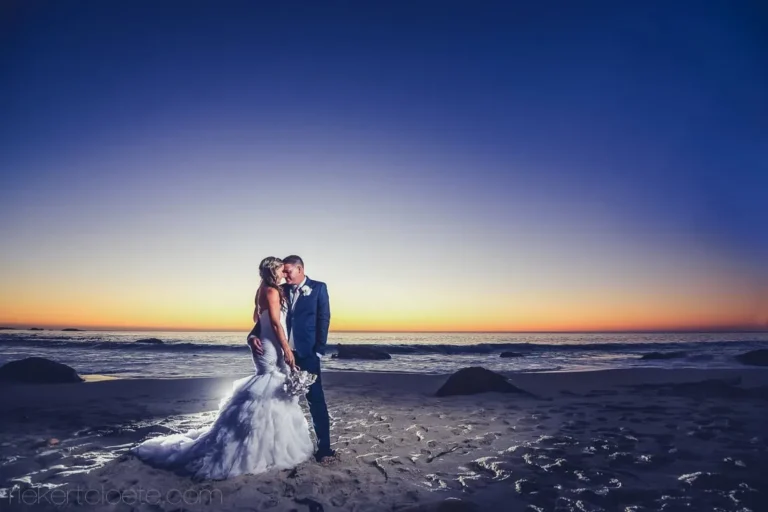 couple beach mermaid gown deep blue orange sunset