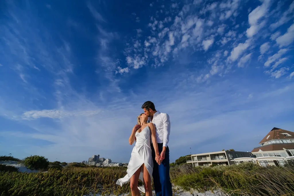couple coastal dunes blue sky cape town elopement