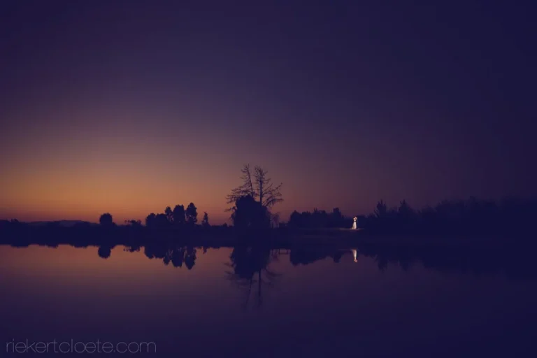 couple dam reflection amber sunset dusk wide