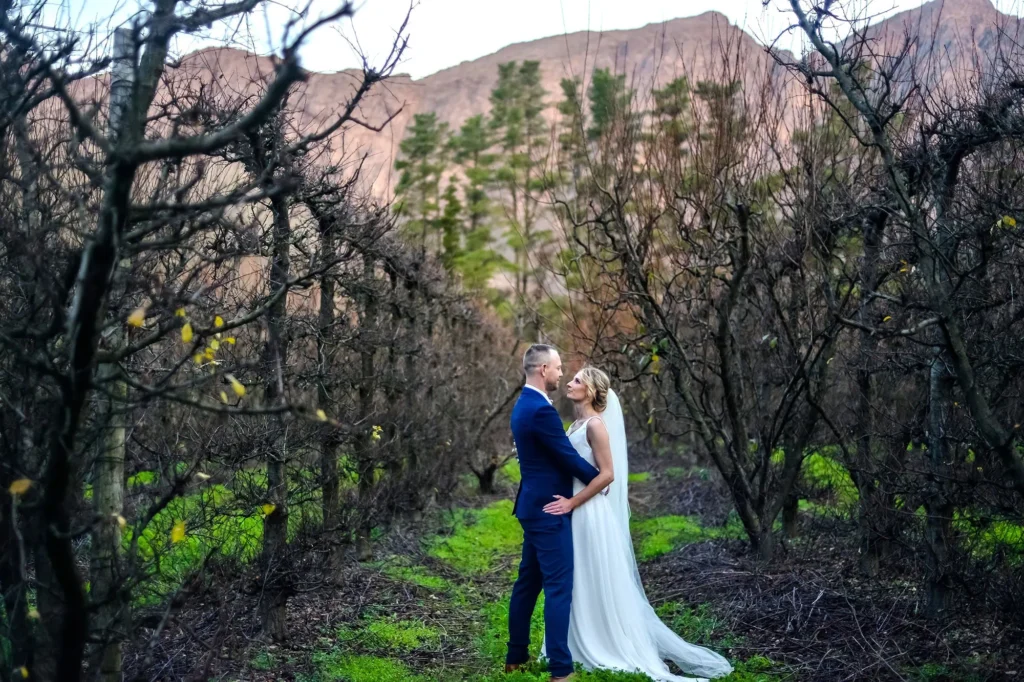 couple embrace colourful orchard red mountain sunset