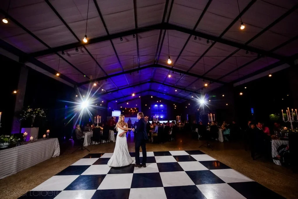 couple first dance blue uplighting marquee checkered
