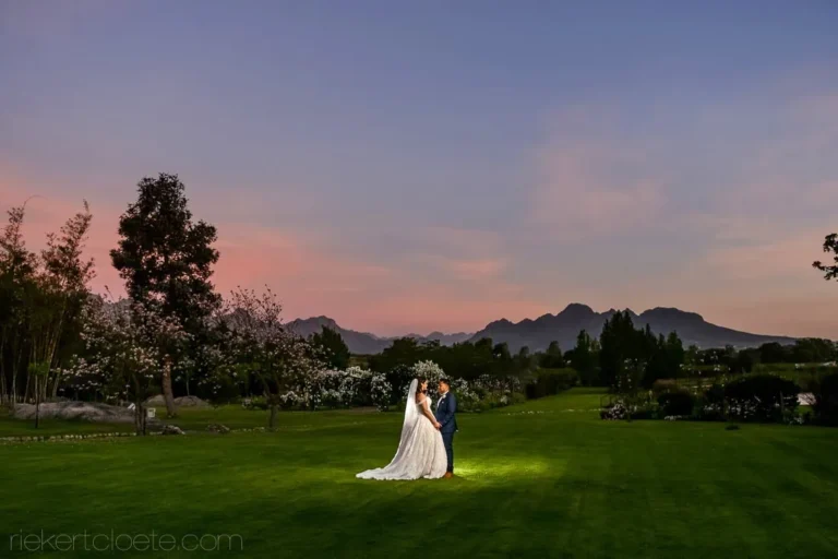 couple garden lawn twilight mountain pink sky