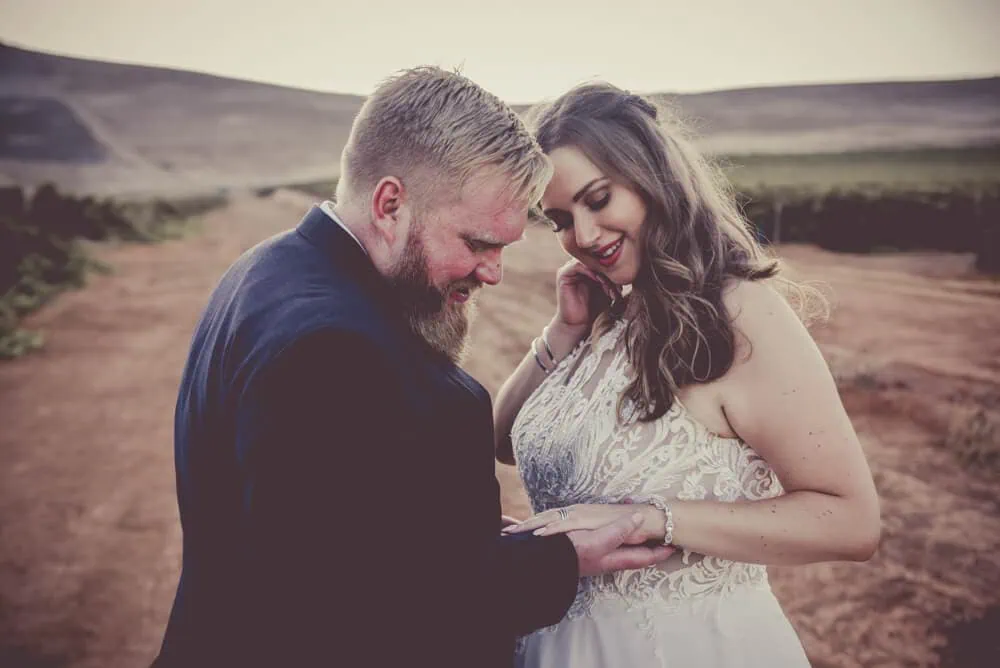 couple intimate moment looking at ring winelands