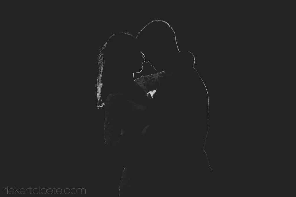 couple intimate portrait rim light black white