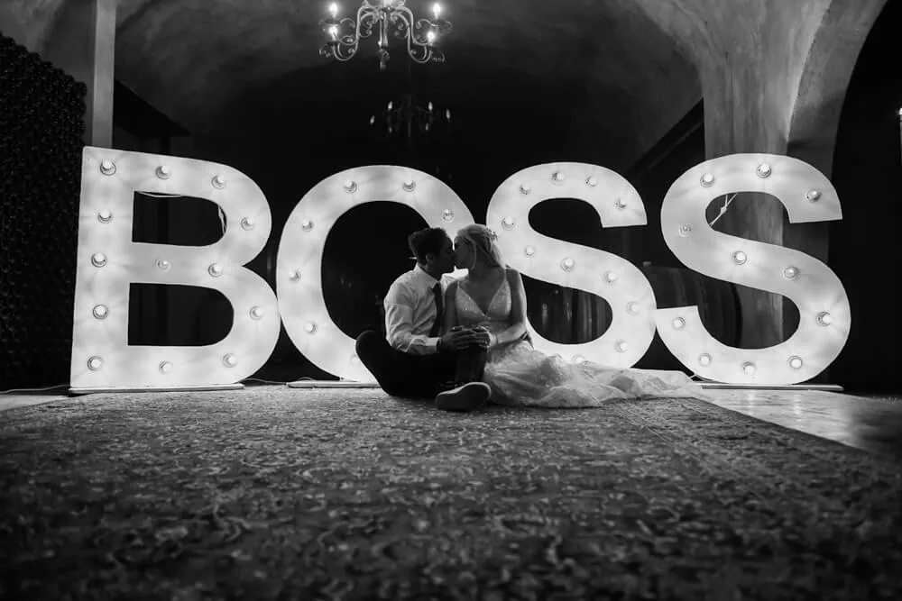 couple kissing boss letters stone venue mont pellier