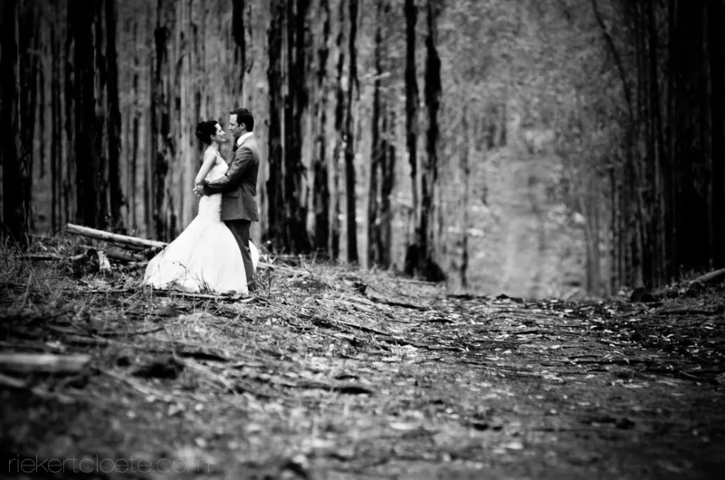 couple kissing dense forest woodland path