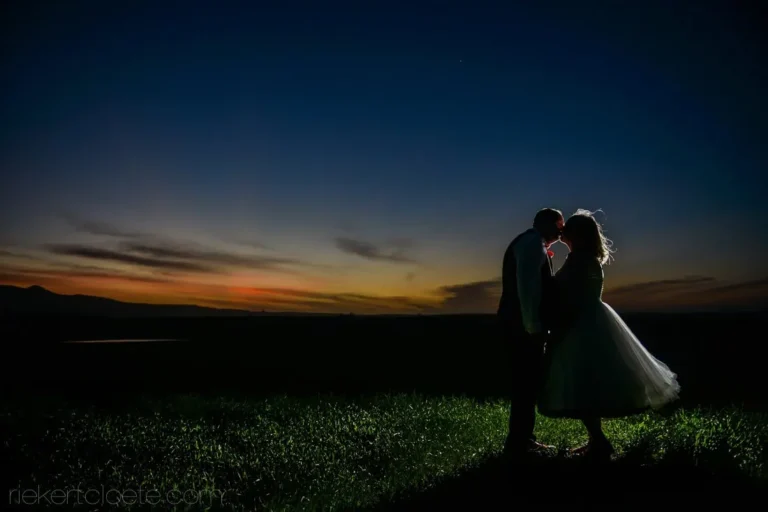 couple kissing silhouette golden sunset dusk landscape