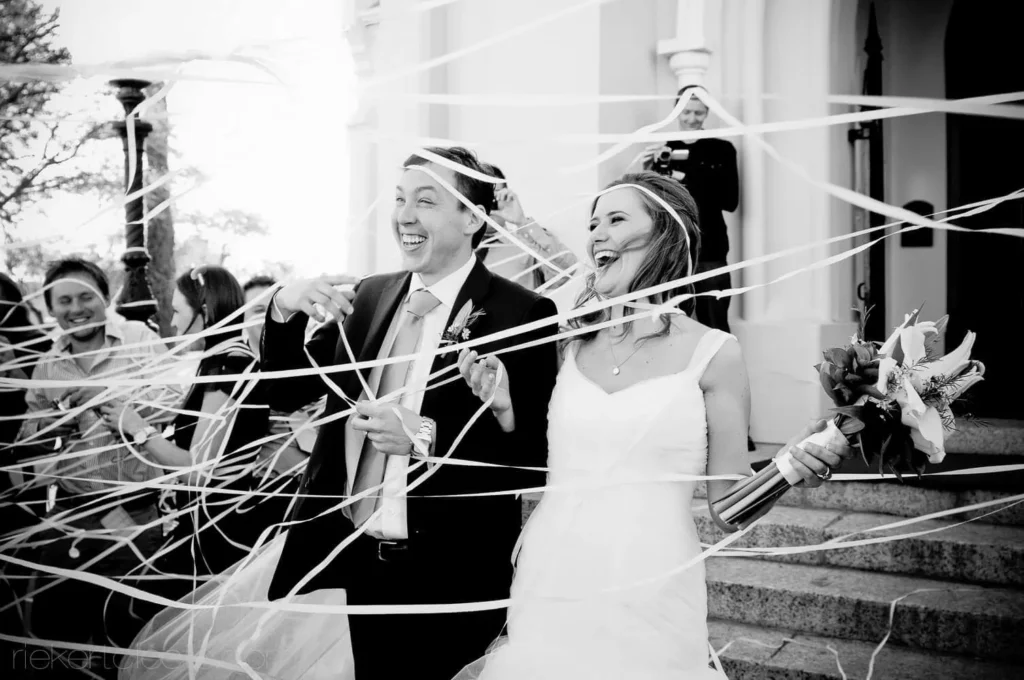 couple laughing ribbon exit robertson church ceremony