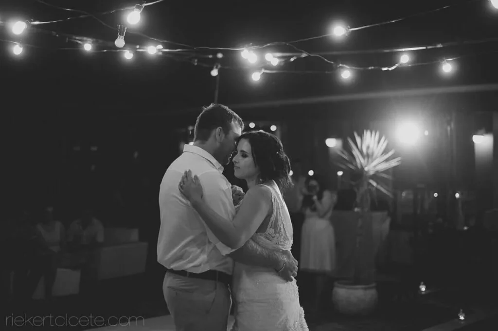 couple outdoor first dance festoon lights evening