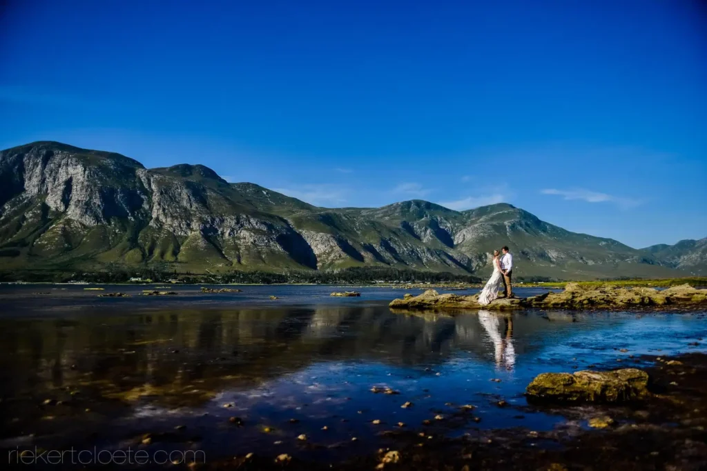 couple rock tidal pool mountain reflection portrait