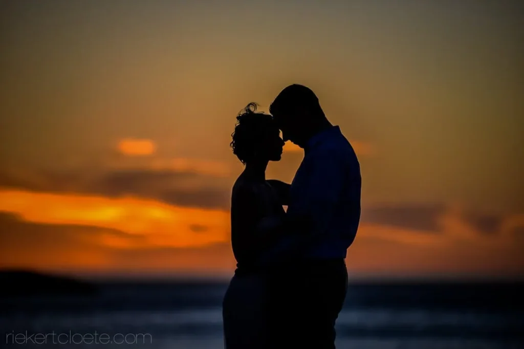 couple silhouette ocean sunset camps bay retreat