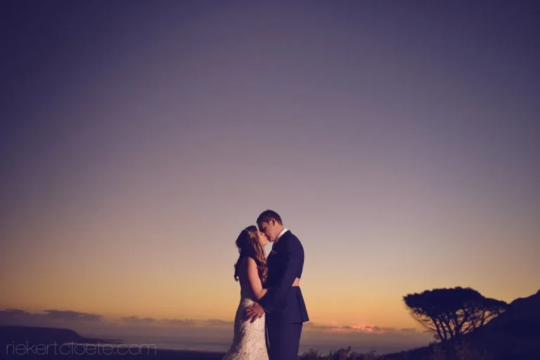 couple silhouette ocean sunset mountain vista