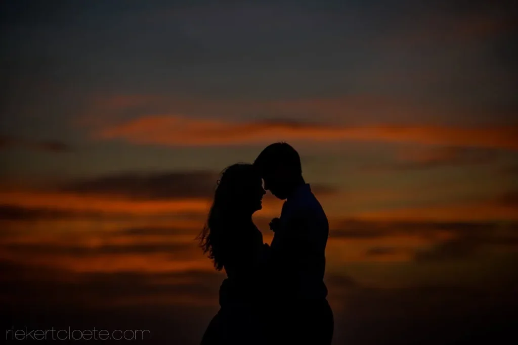 couple silhouette sunset blouberg beach wedding
