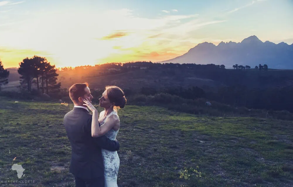 couple sunset mountain golden hour embrace