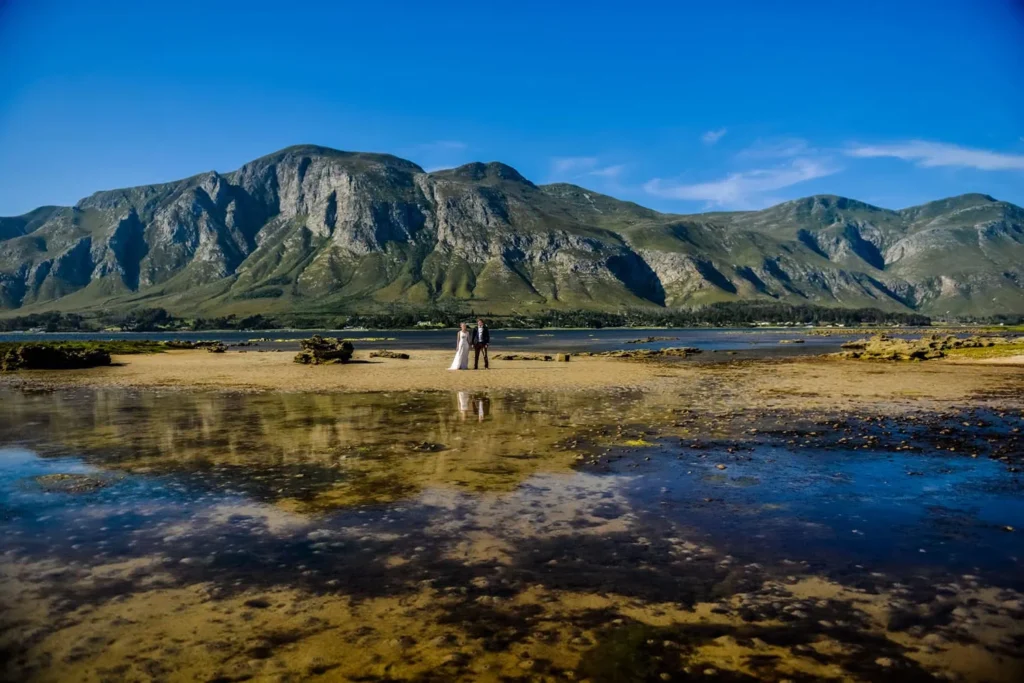 couple tidal flats mountain reflection water