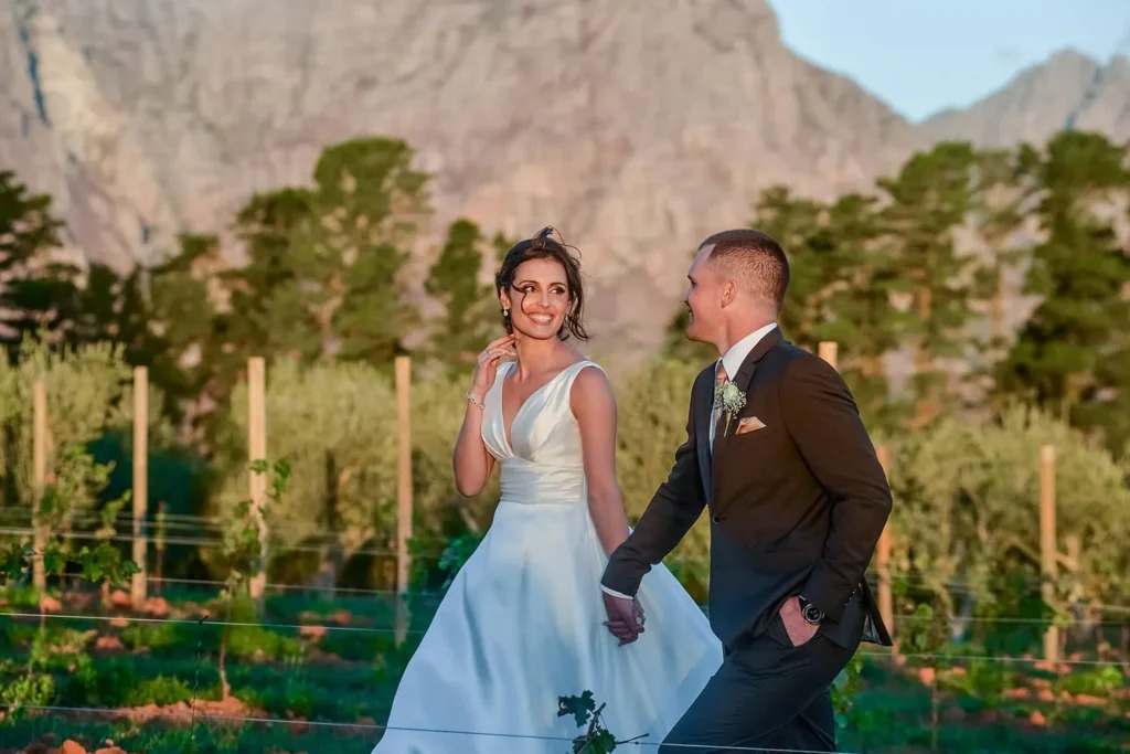 couple vineyard golden hour winelands mountains