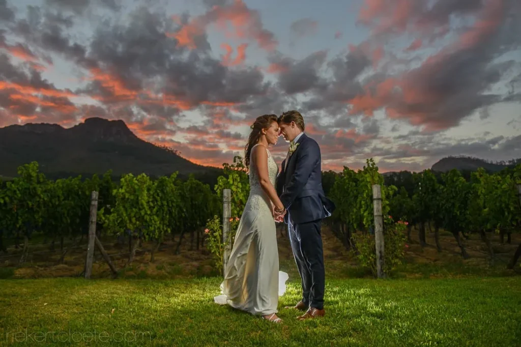 couple vineyard sunset dramatic red clouds