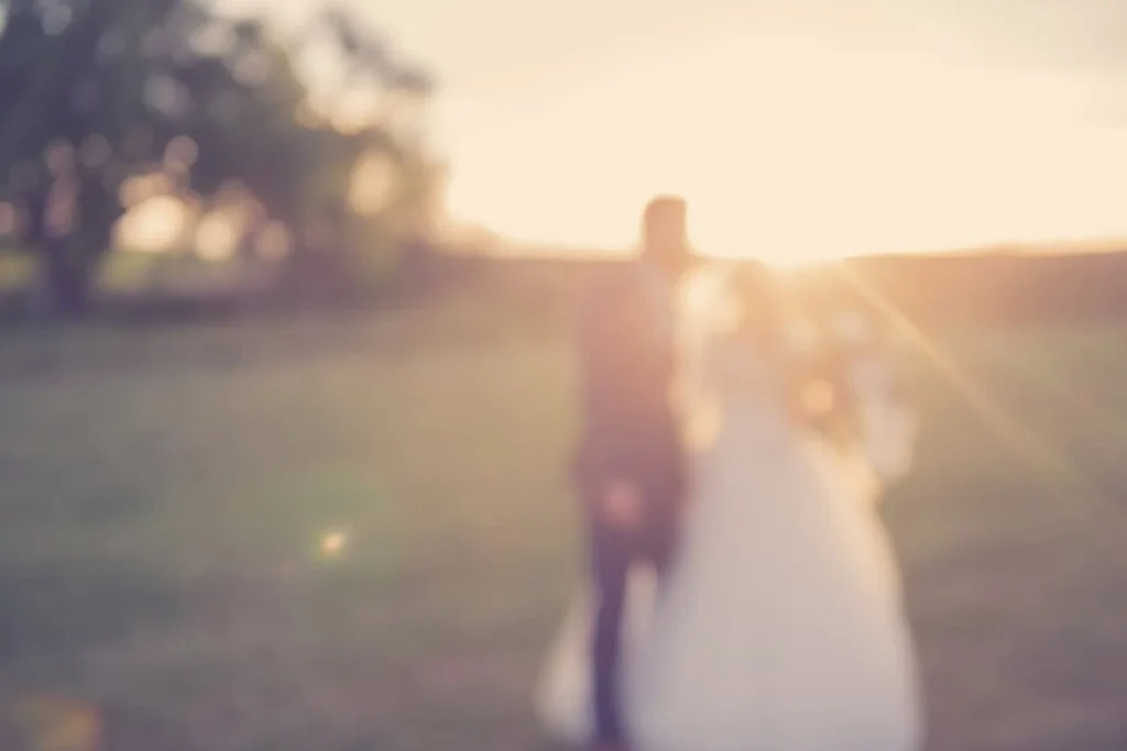 dreamy blur couple walking garden golden hour