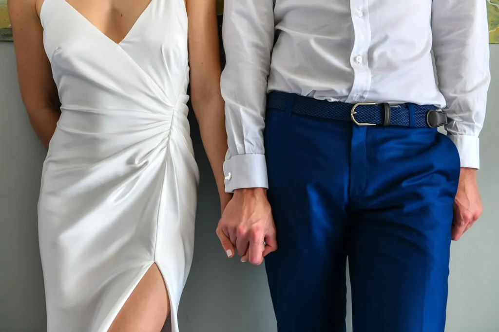 elopement couple holding hands white satin dress