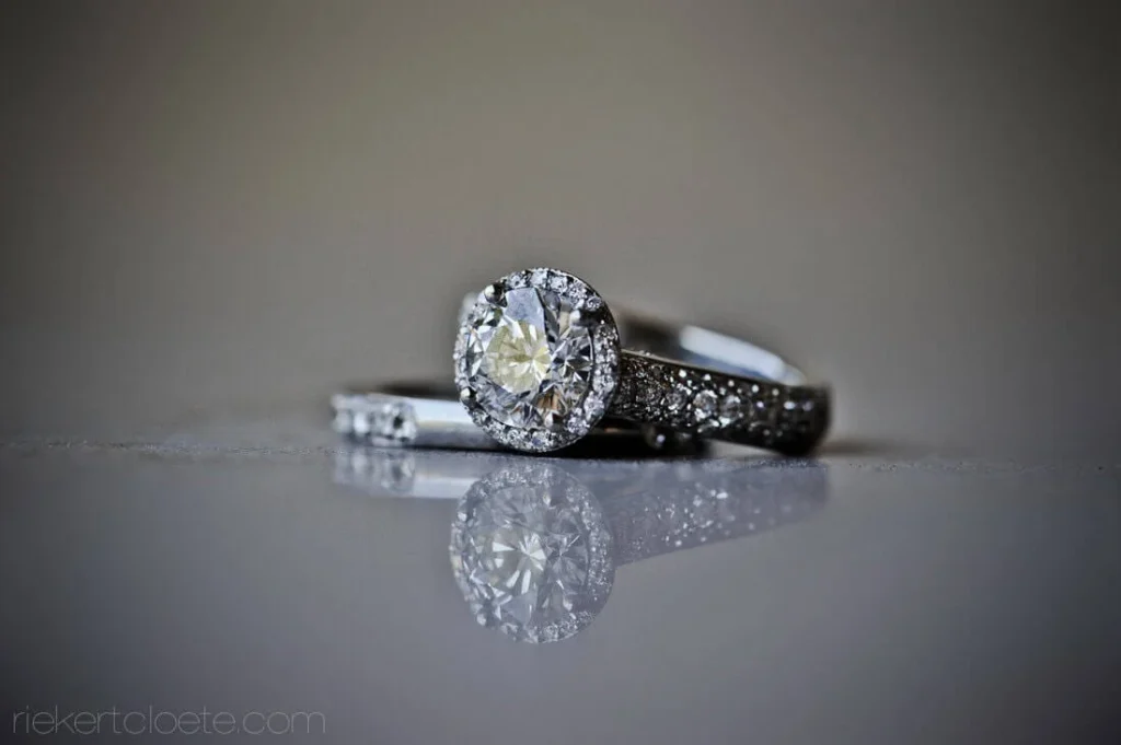 gold wedding band diamond eternity ring green bokeh