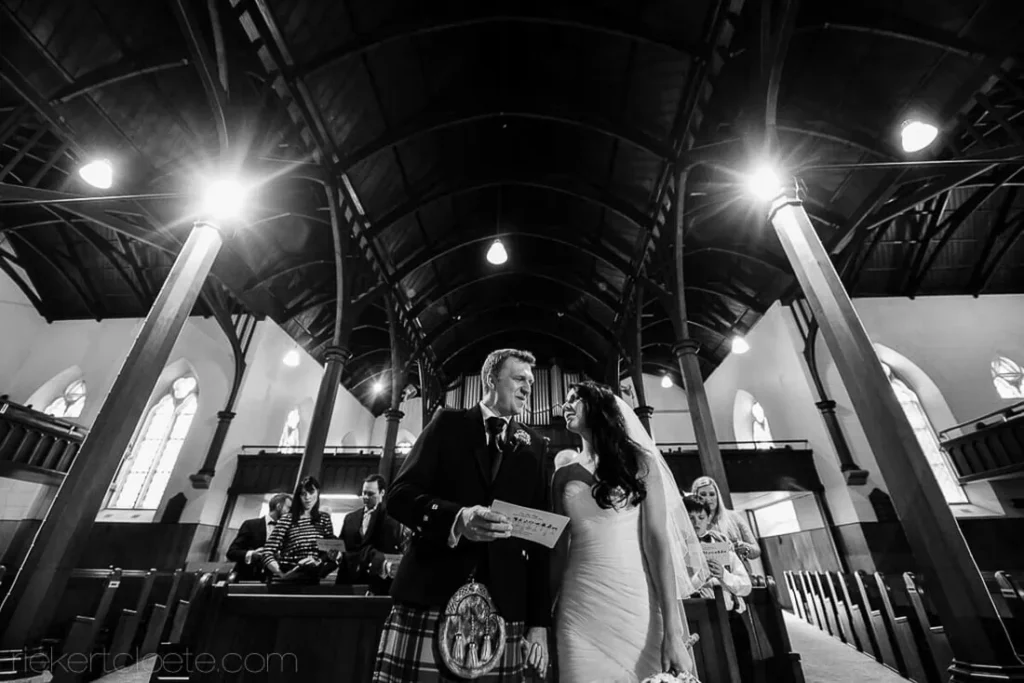 gothic church ceremony dark columns couple altar
