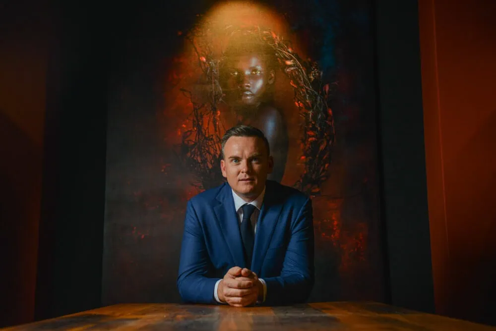 groom blue suit dramatic artwork seated portrait