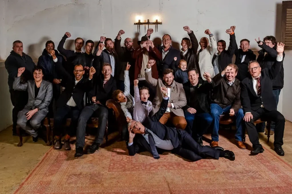 groom groomsmen group photo rustic cellar venue
