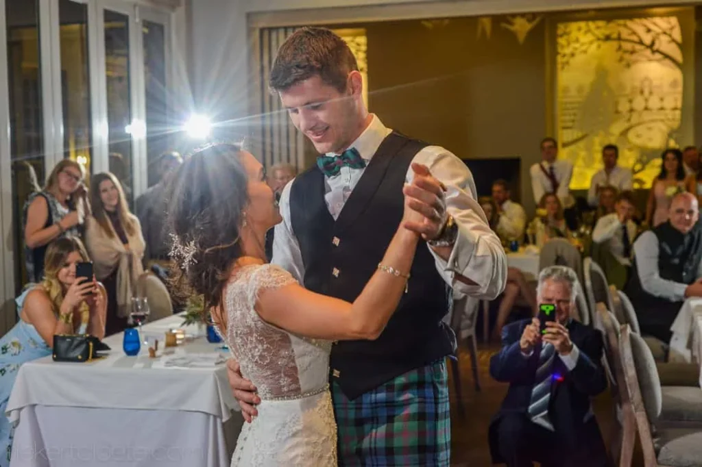 groom kilt teal bowtie first dance indoor reception