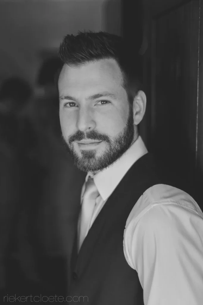 groom waistcoat beard dramatic backlit portrait