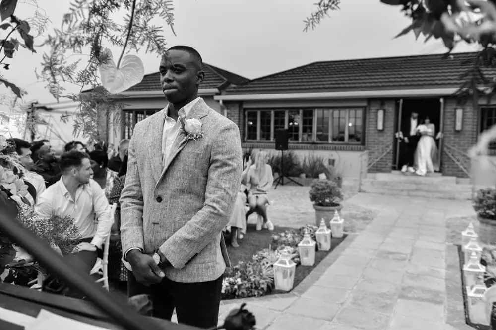 groom waiting suikerbossie outdoor ceremony aisle