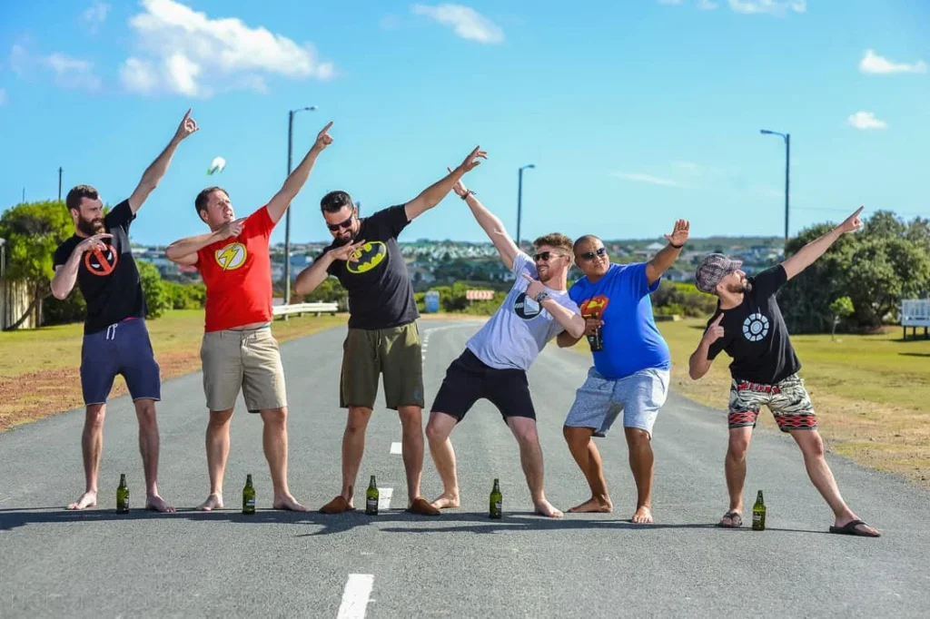 groomsmen superhero shirts fun road pose