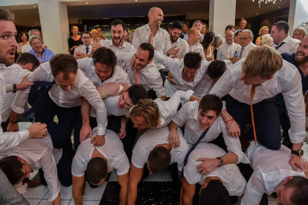 groomsmen wild group pile wedding dance floor