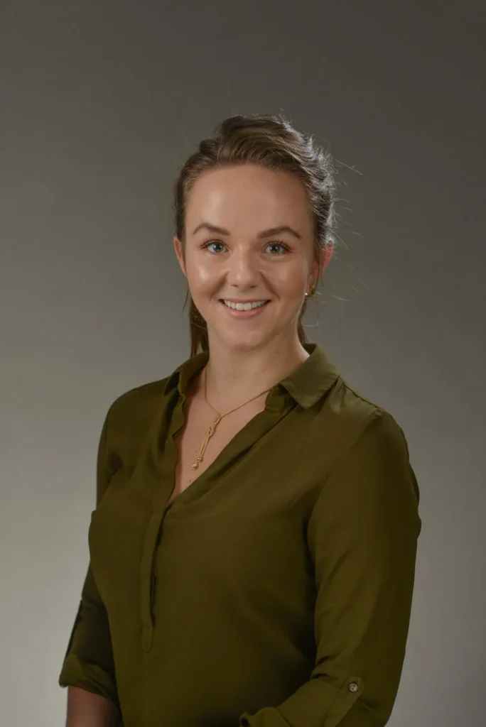 headshot photographer cape town dark grey background 20 woman friendly smile