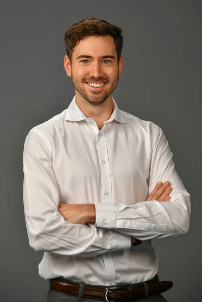 headshot photographer cape town dark grey background 21 man professional smile