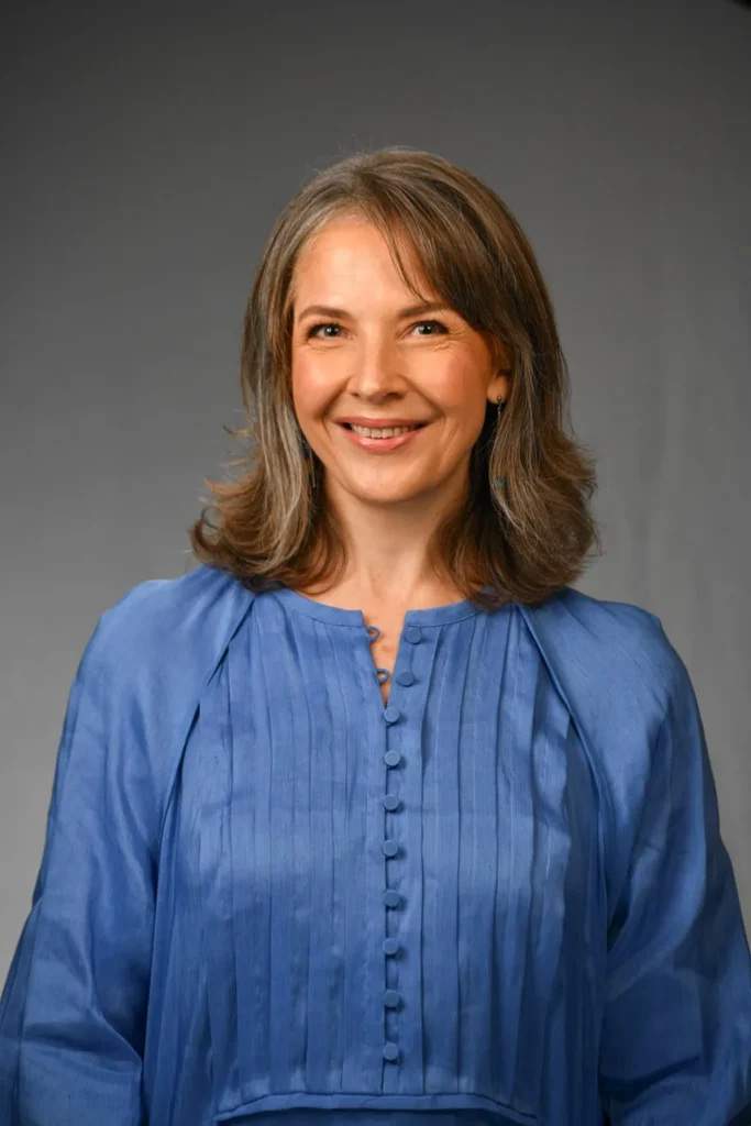 headshot photographer cape town dark grey background 24 woman warm smile