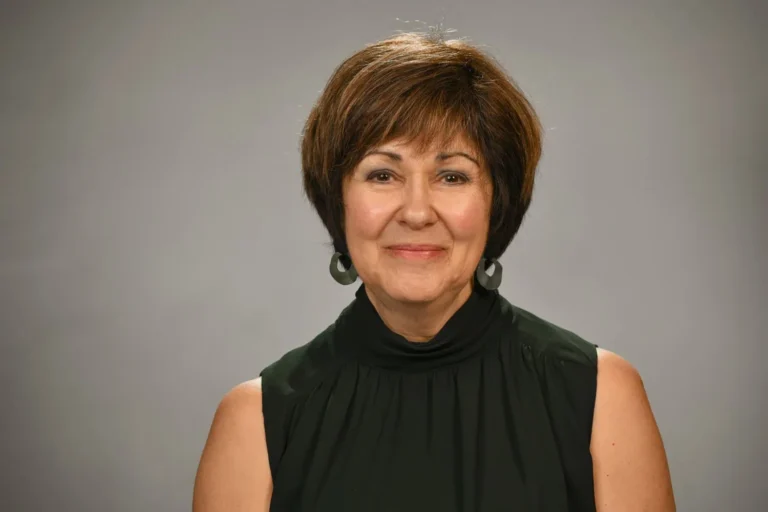 Woman, professional portrait, on a grey backdrop